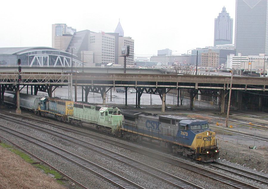 CSX SB freight with "funny" green leasor 